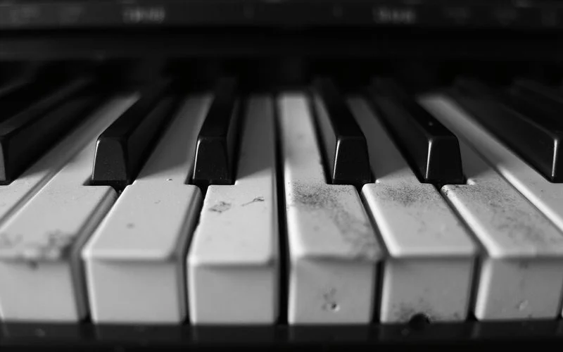 Close-up of two piano keyboards compared side by side